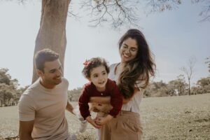 Happy family enjoying summer outdoors, symbolizing life events that may impact next year’s tax return